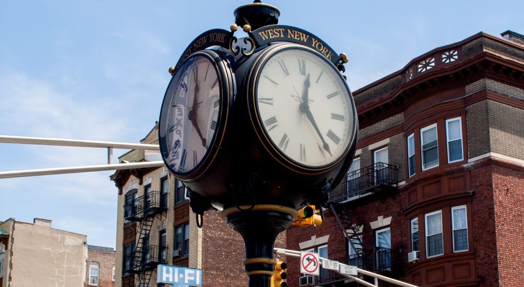 small clock tower on West New York street